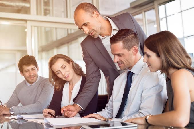 Business partners discussing partnership firm registration documents